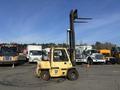 A yellow 1993 Hyster H80XL forklift with a raised lifting mechanism and large front wheels positioned on a paved surface