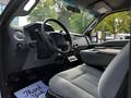 Interior of a 2016 Ford F-550 featuring a driver’s seat and dashboard with controls and a digital display