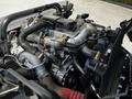A detailed view of the engine of a 2018 Hino 195 showcasing various components such as pipes wires and filters