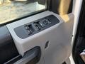 Close-up of the control panel on the driver's side of a 2018 Ford F-350 SD featuring window and mirror controls