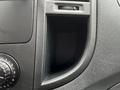 A 2023 Mercedes-Benz Metris interior detailing with a focus on the dashboard compartment and control knob