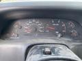 Dashboard of a 2002 Ford F-550 displaying speedometer fuel gauge and other instrument readings