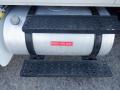 A diesel fuel tank with a label reading DIESEL FUEL ONLY positioned above metal steps on a 2014 International Durastar truck