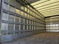 A 2016 Freightliner M2 106 truck with an empty cargo area featuring metal siding and wooden flooring