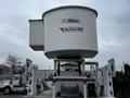 A 2011 Western Star Trucks 4900 with a large bucket and work platform attached on top featuring Altec and AltaLink logos