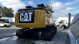 A 2018 Caterpillar 326F L Excavator with a yellow exterior and a prominent CAT logo on the back