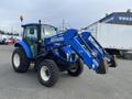 A blue 2016 New Holland T475 tractor with a front loader attachment and large tires, designed for agricultural and commercial use