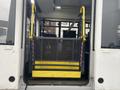 A yellow wheelchair lift inside the back of a 2018 Chevrolet Express van