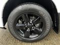 Front wheel of a 2022 RAM 1500 Classic featuring a black alloy rim with five spokes and Goodyear Wrangler tire