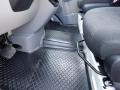 Interior view of a 2016 Mercedes-Benz Sprinter highlighting the floor and seat area with textured flooring and black upholstery
