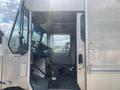 A 2007 Morgan Olson Workhorse W42 delivery truck with an aluminum body showing the driver's side door and interior cab featuring a steering wheel and driver's seat