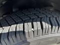 Close-up of a tire tread on a 2019 Chevrolet Express showing deep grooves and patterns for traction