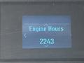 A display screen showing the text Engine Hours and the number 2243