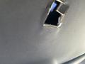 A damaged interior panel of a 2021 Ford Explorer with a visible hole in the fabric