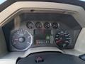 Dashboard of a 2009 Ford F-550 showing various gauges including speedometer tachometer fuel level and gear selector