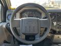 Steering wheel of a 2008 Ford F-450 SD with dashboard gauges and controls visible in the background