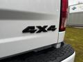 Close-up of a 2022 RAM 1500 Classic rear badge displaying 4x4 in bold black lettering