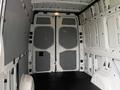 A 2019 Mercedes-Benz Sprinter van with a spacious interior featuring bare walls and no cargo, designed for transport or storage purposes