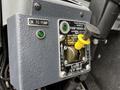 Control panel of a 2009 Spartan Gladiator featuring a lever labeled to pump with green indicator lights and instructions for operation