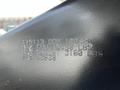 Close-up of a metal plate displaying specifications for a 2021 Grand Design Recreational 311BHS including weights and manufacturing details