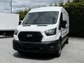 A white 2022 Ford Transit van with a black grille and front bumper facing the viewer