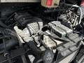 Close-up of the engine compartment of a 2009 Morgan Olson Workhorse showing various components including hoses a battery and an air intake assembly