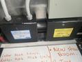 Two electrical control boxes labeled VTA-30R and GPF-30R positioned adjacent to each other on a surface with handwritten notes beneath them