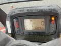Dash display of a 2015 Kubota F3990 showing engine indicators and hour meter with dirt on the surface