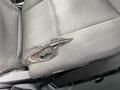 Close-up of a torn and worn driver's seat in a 2021 Ford Explorer showing frayed fabric and exposed padding