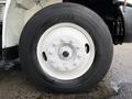 2013 International Durastar 4300 tire showcasing a white rim with multiple bolts and a black Michelin tire with visible tread pattern