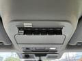 Overhead control panel in a 2023 Ford F-550 featuring six switch buttons labeled AUX 1 to AUX 6 and additional labels for comp and PTO