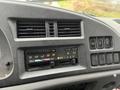 Dashboard controls of a 2006 GMC F7B042 including climate control buttons with indicators for cold hot and air conditioning settings