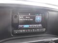 A 2015 Chevrolet Silverado 1500 dashboard display showing a radio tuner set to the song Easy On Me by Adele on FM station 94.5