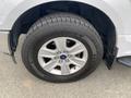Close-up of a silver 2018 Ford F-150 wheel showing a metallic rim and a large tire with the brand name visible