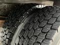 Two closely positioned tires with deep treads and unique patterns designed for traction and stability