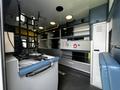 Interior of a 2013 Chevrolet Express configured as an ambulance featuring medical equipment storage and space for patient care