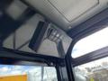 Close-up of the control panel inside a 2024 AGT Industrial QH13R Mini Excavator featuring buttons for various functions
