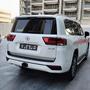 A 2022 Toyota Land Cruiser GXR in white with a distinctive rear design featuring a prominent logo and modern tail lights