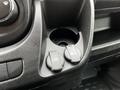 Close-up of a console with two charging ports labeled USB and 12V DC in a 2021 RAM Promaster