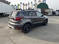 A grey 2019 Ford Escape parked with black alloy wheels and a rear-mounted camera