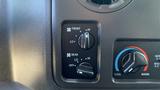 Controls for the heating and air conditioning system in a 2013 Ford Econoline with settings for front and rear airflow