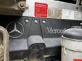 2006 Freightliner M2 112 engine displaying the Mercedes Benz logo with visible components and warning label