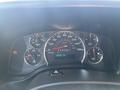 Dashboard of a 2013 Chevrolet Express displaying speedometer fuel gauge and warning lights with odometer reading 188652 km