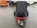 A 2017 Ferris Rotary mower viewed from the back showcasing its large rear tires and sturdy seat design