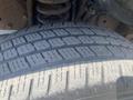Close-up of a 2009 Ford Econoline tire showing detailed tread patterns and wear indicators