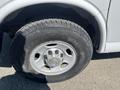 Close-up of a 2012 Chevrolet Express tire showing tread patterns and alloy wheel with a Chevrolet emblem