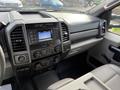 Interior dashboard of a 2020 Ford F-550 showing controls and infotainment system