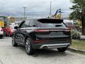 A black 2020 Lincoln Corsair parked with a sleek design featuring a rear spoiler and dual exhaust outlets