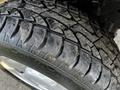 Close-up of a tire from a 2008 Ford F-150 XL showing detailed tread pattern and surface texture