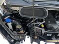 2017 Ford Transit engine compartment showing various components including the radiator cap battery and hoses
